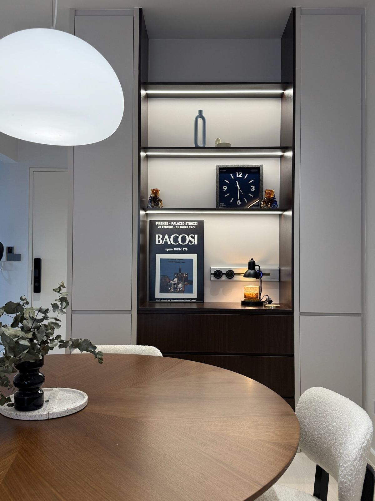 Display cabinet with LED shelving and dark walnut interior next to dining area - KL