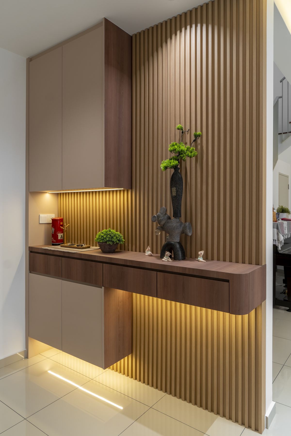Foyer built-in cabinet with slatted wall panel and warm LED lighting